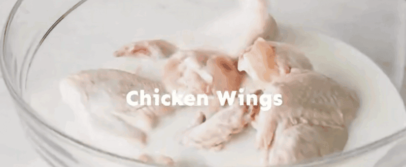 Chicken wings in a bag with buttermilk.