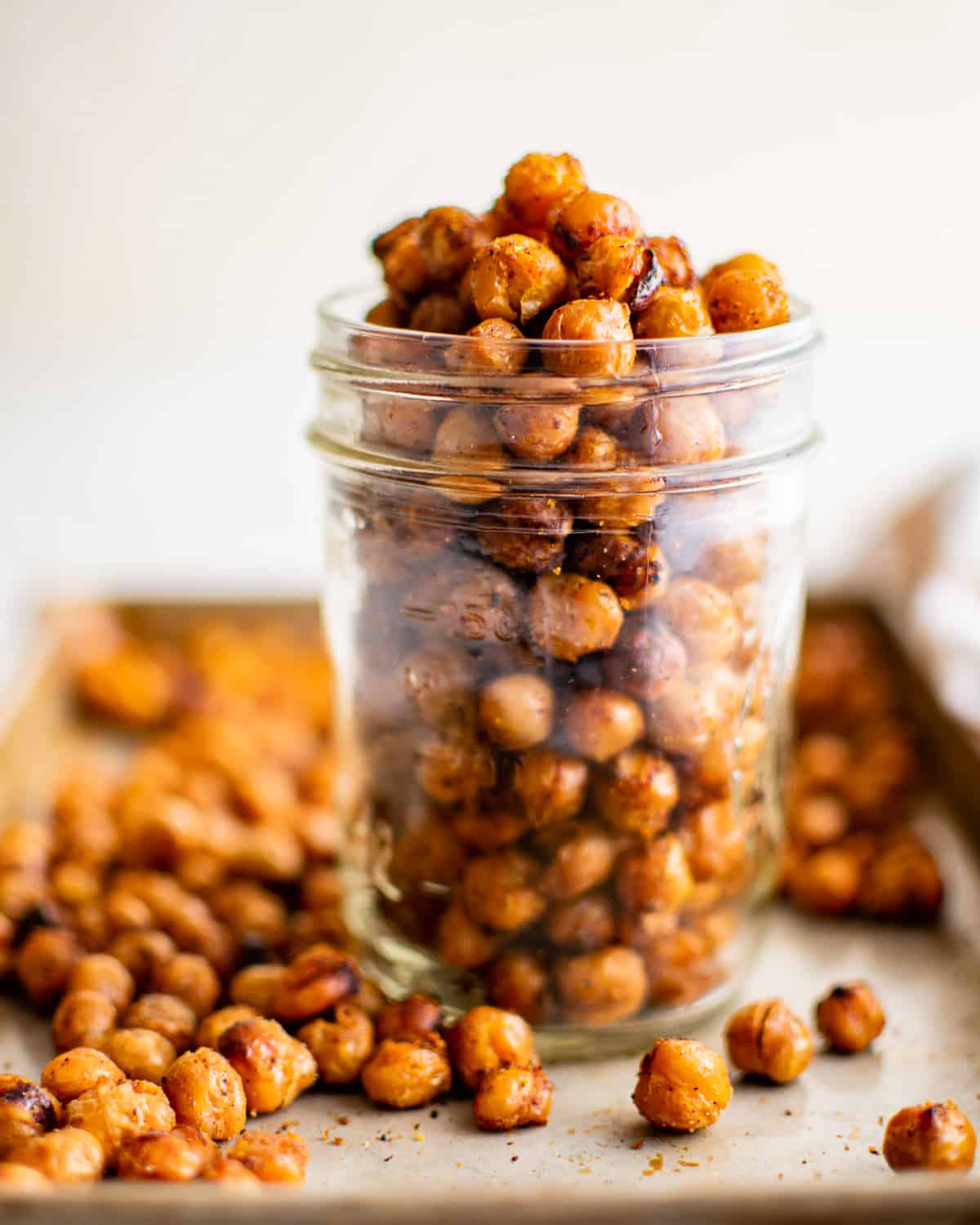 a mason jar filled to the brim with air fryer chickpeas.