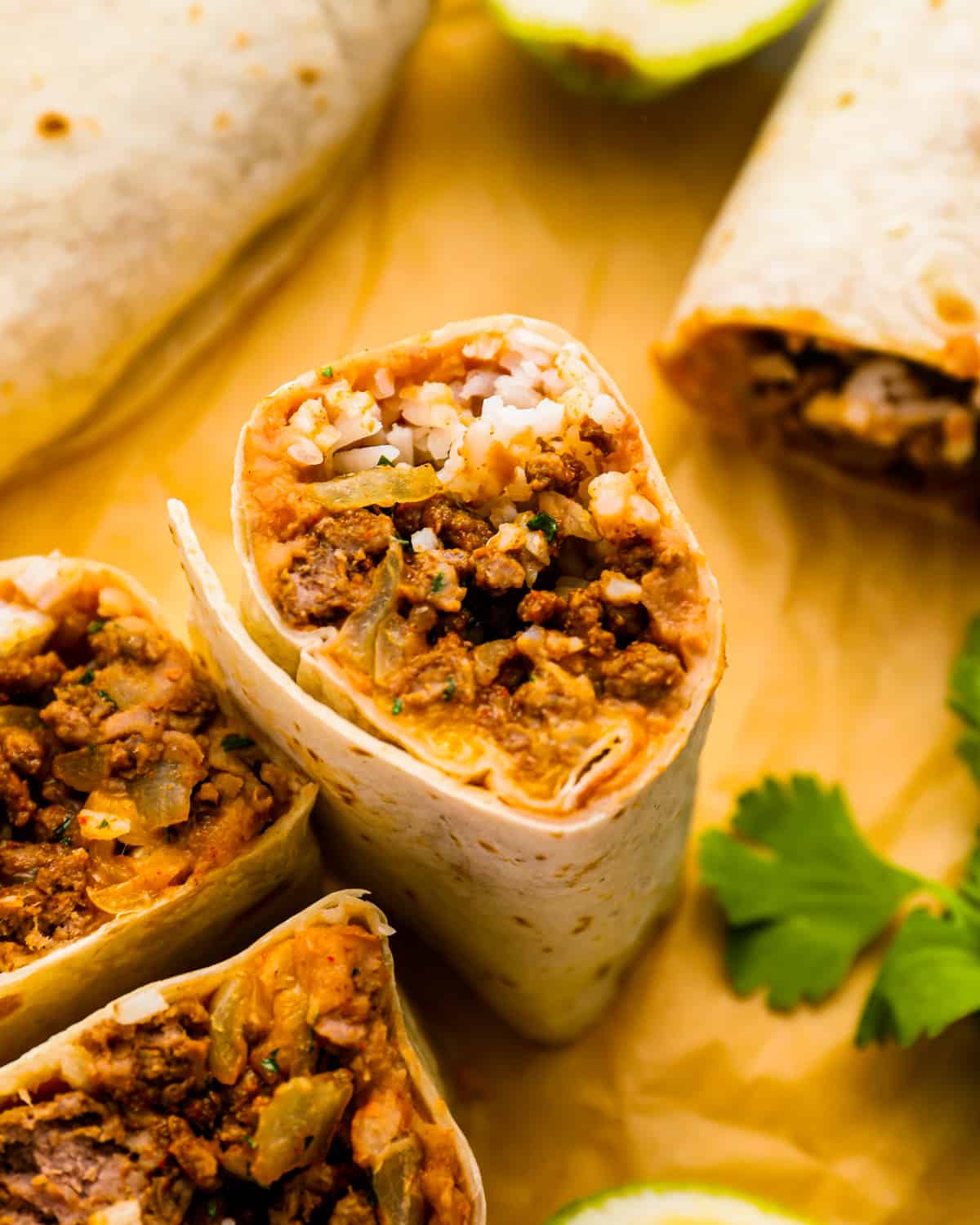 mexican beef burritos with lime and cilantro.