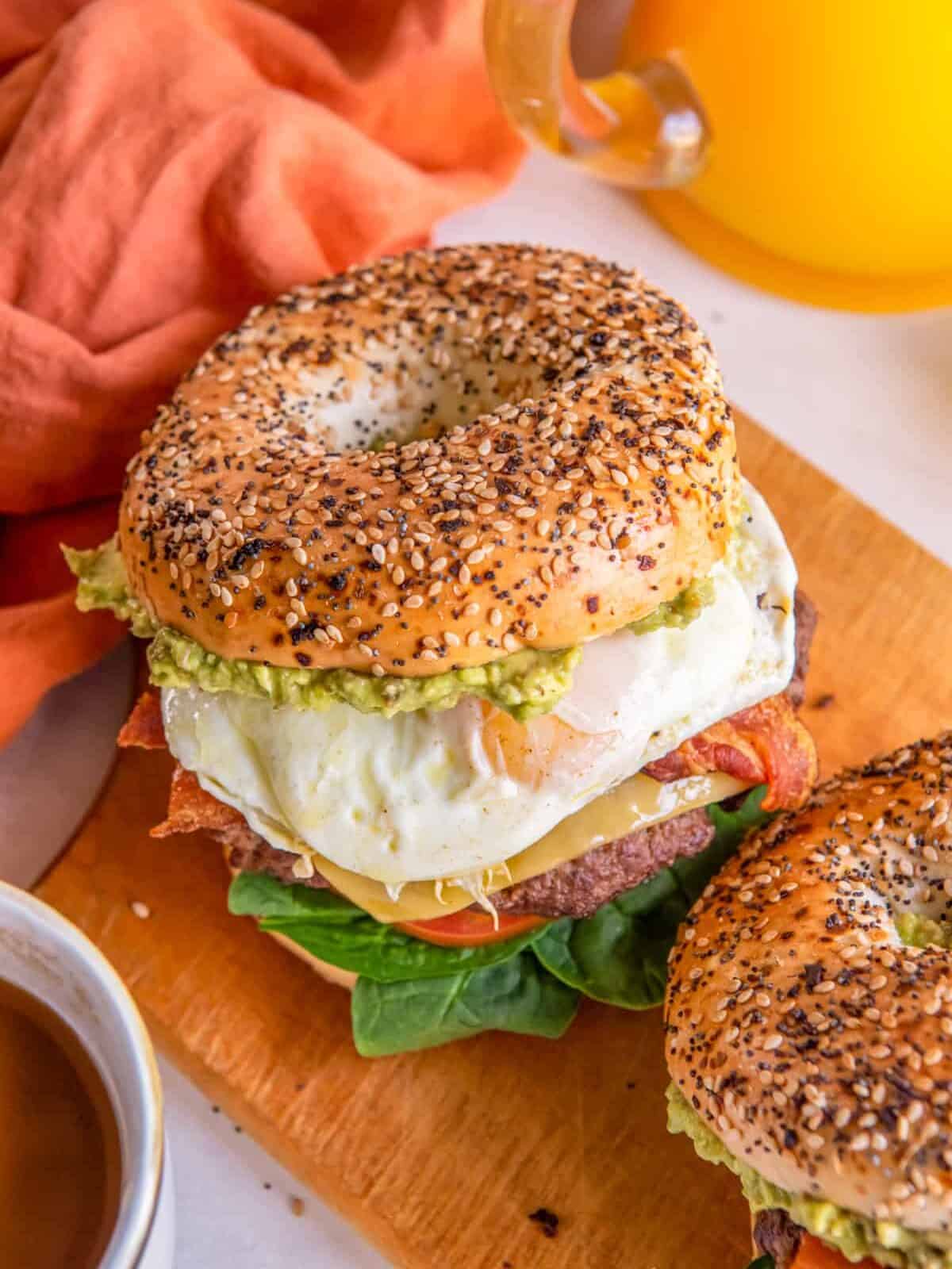 breakfast burgers on a wooden cutting board.