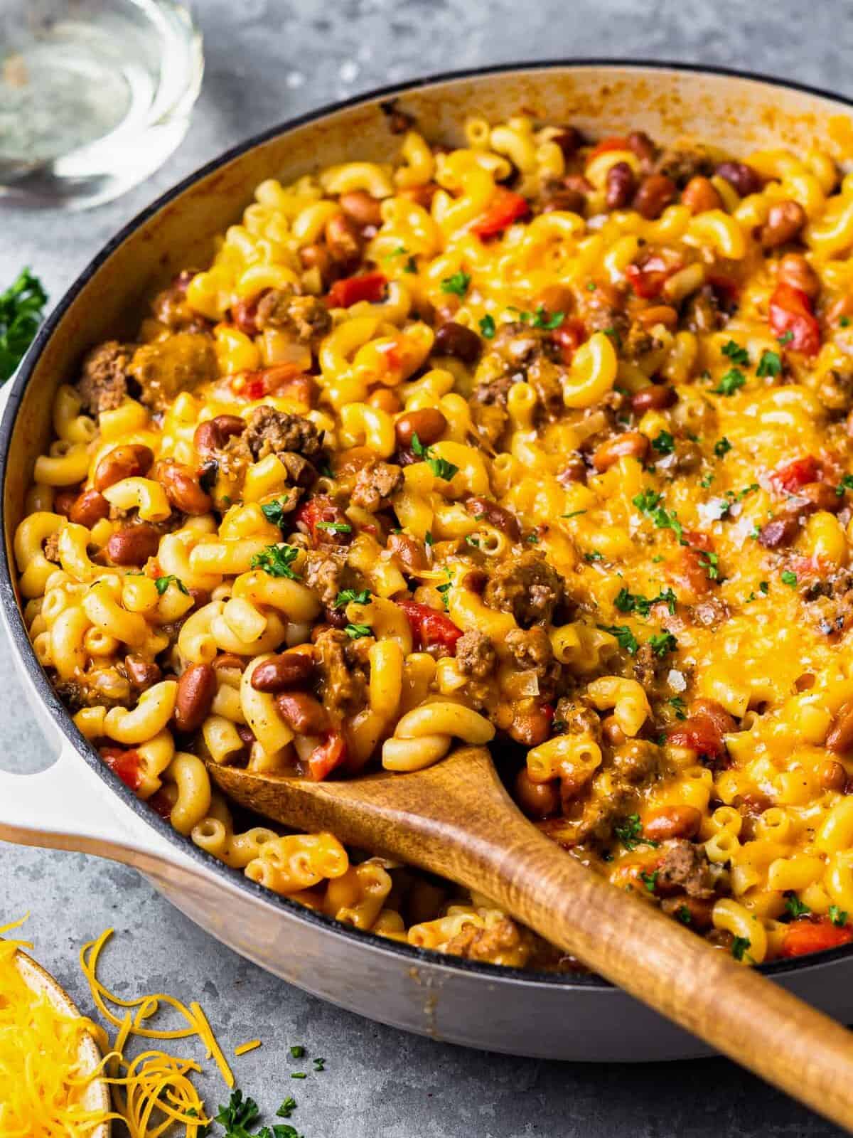 chili mac and cheese in a white pot