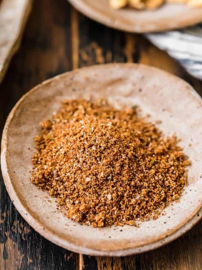 a shallow bowl filled with pork dry rub mix