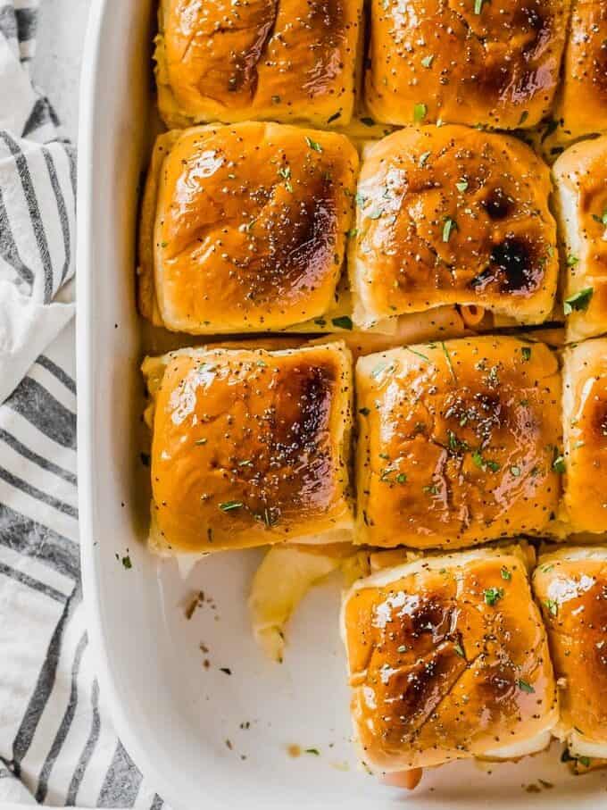 overhead view of ham and cheese sliders in a baking dish