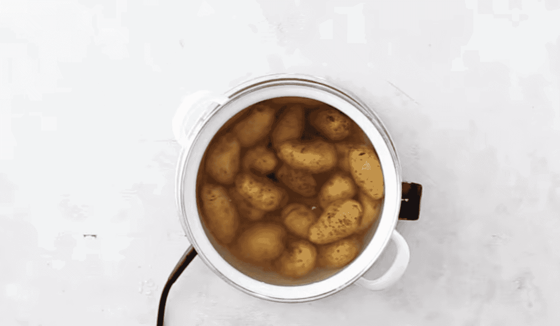Boiling potatoes in a pot.