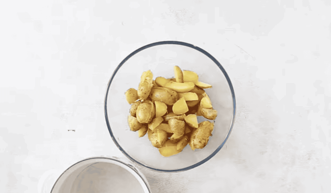 Chopped cooked potatoes in a bowl.