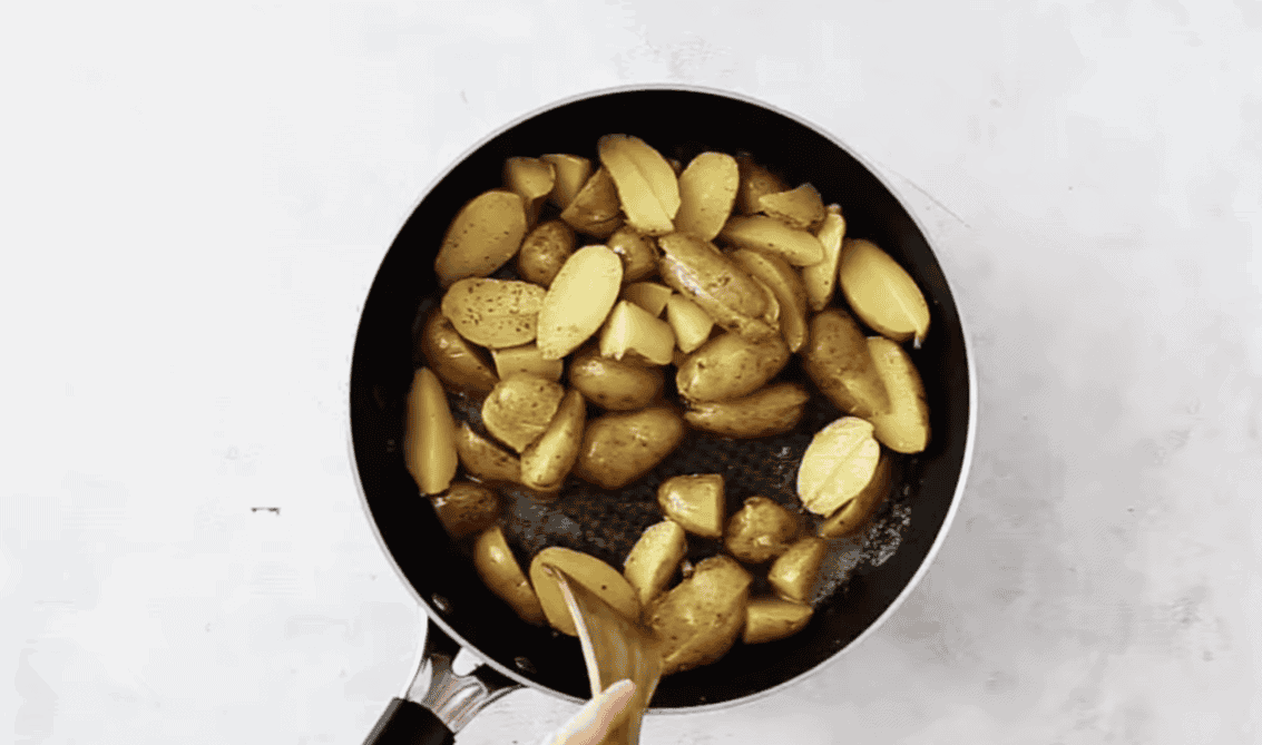 Sauteeing chopped potatoes. 