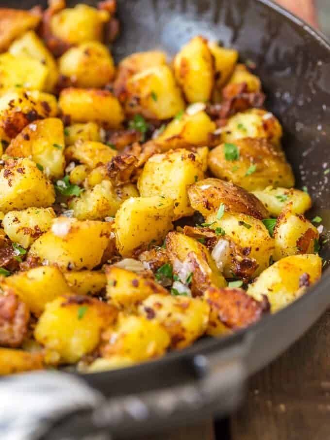crispy breakfast potatoes with onions in a skillet