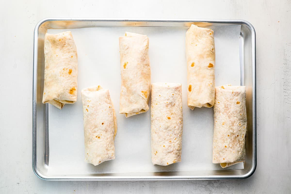 a tray of beef burritos.