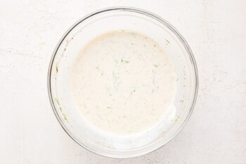 dressing for shrimp pasta salad in a glass bowl.