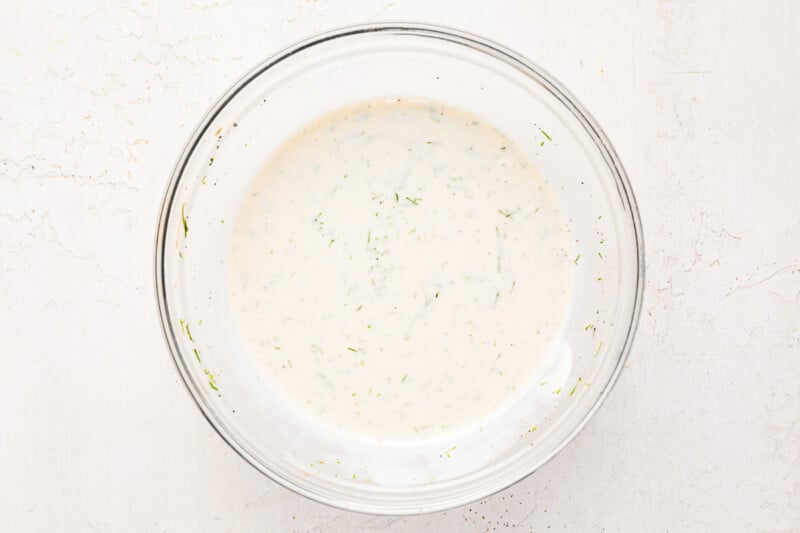 dressing for shrimp pasta salad in a glass bowl.