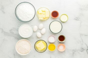 overhead view of ingredients for vanilla cake in individual bowls.