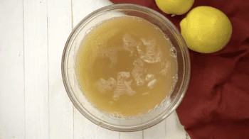 lemon juice, honey, and spices in a glass bowl.