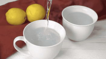 boiled water poured into white mugs.