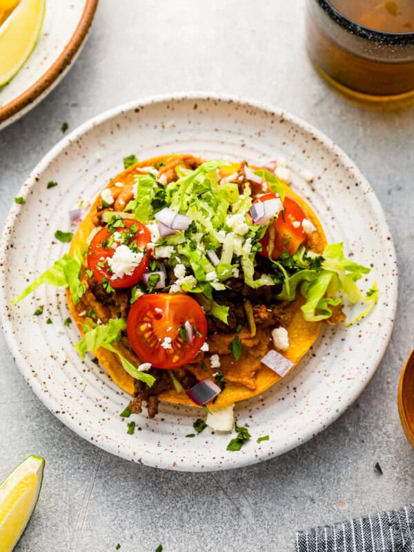 mexican tostadas on a white plate.
