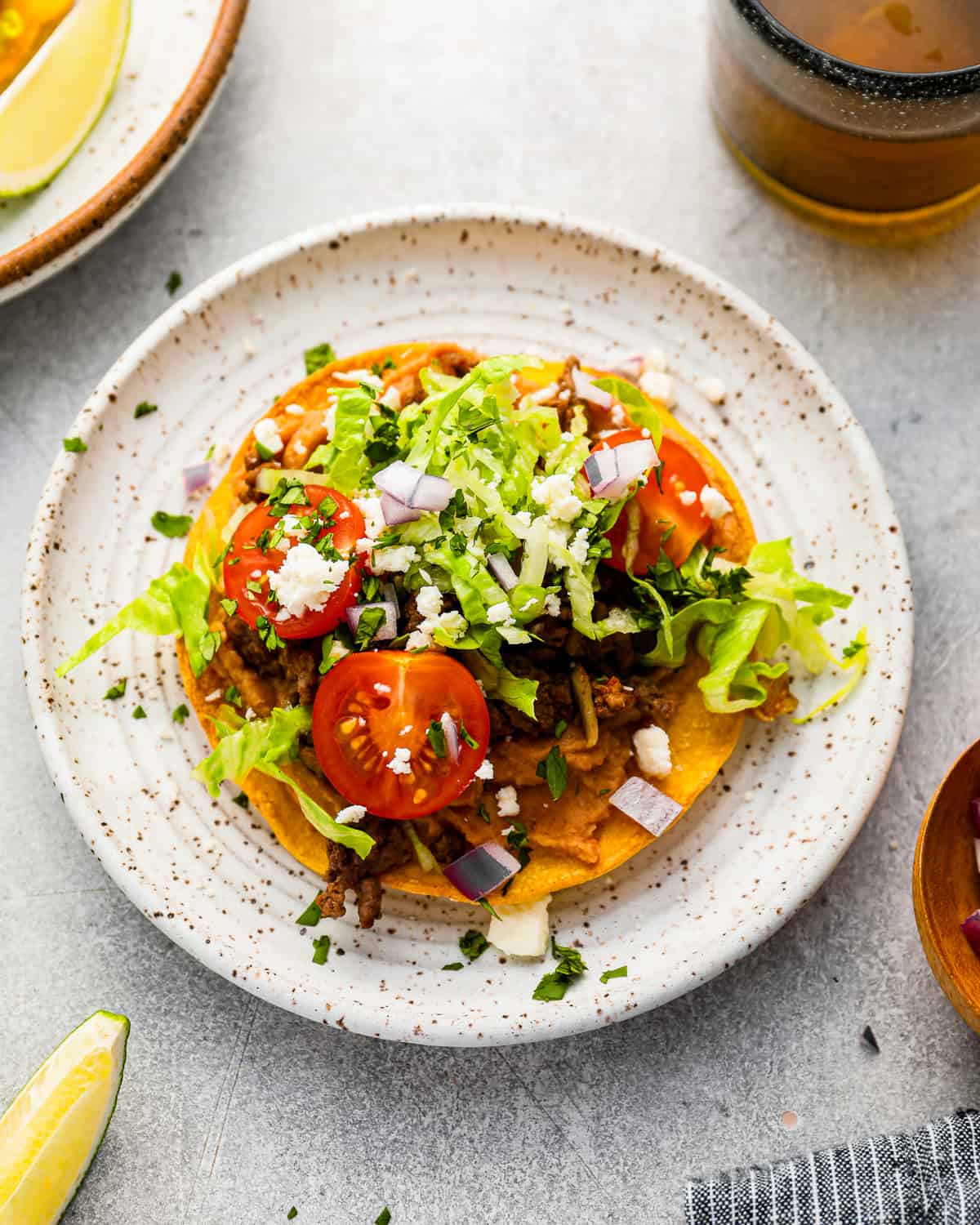 mexican tostadas on a white plate.