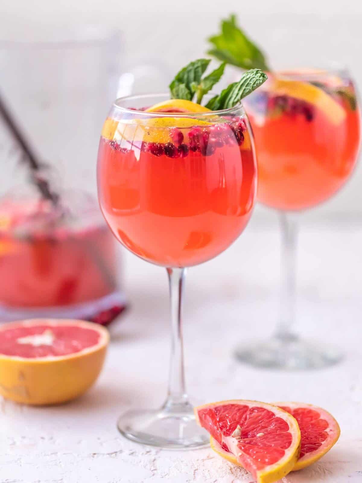 glasses of pink champagne sangria in wine glasses