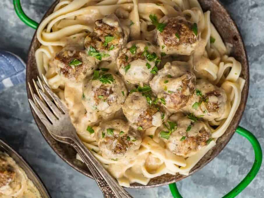 traditional Swedish meatballs served on a plate of noodles
