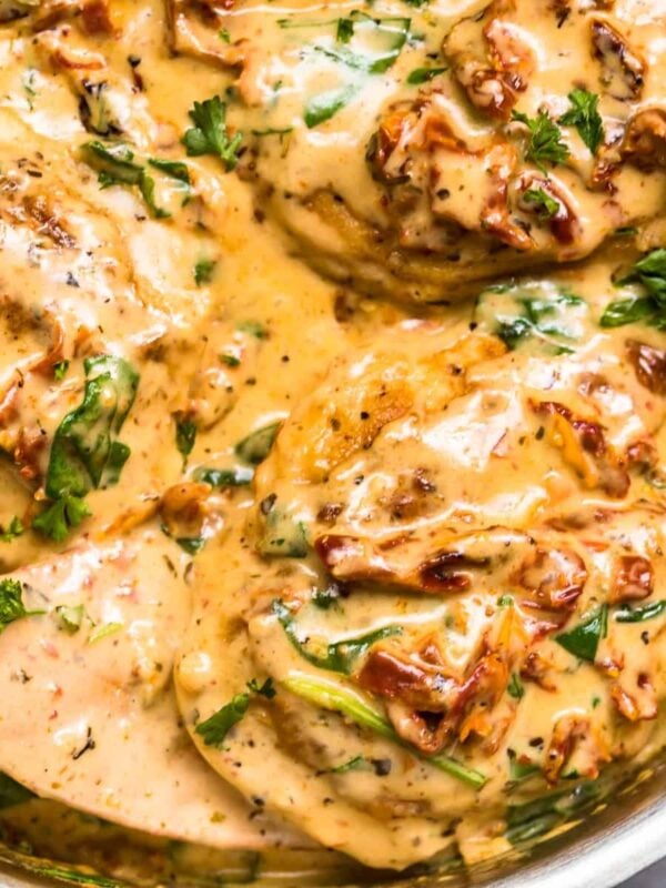 up close image of tuscan chicken in parmesan cream sauce