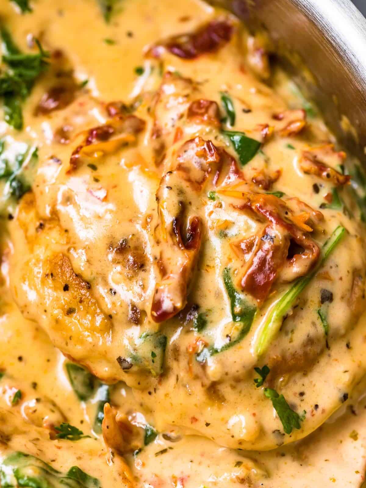 up close image of tuscan chicken in parmesan cream sauce