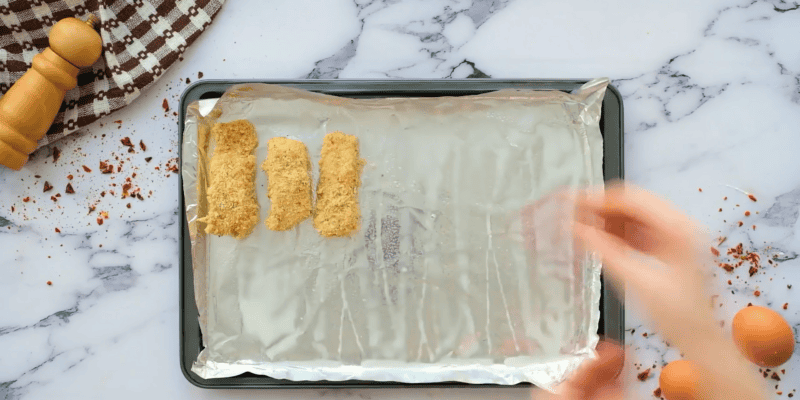 fish sticks placed on baking sheet