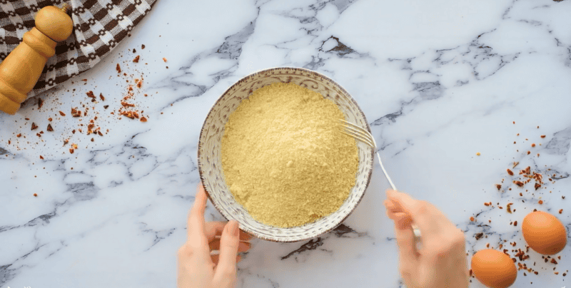 mixing panko and seasoned breadcrumbs