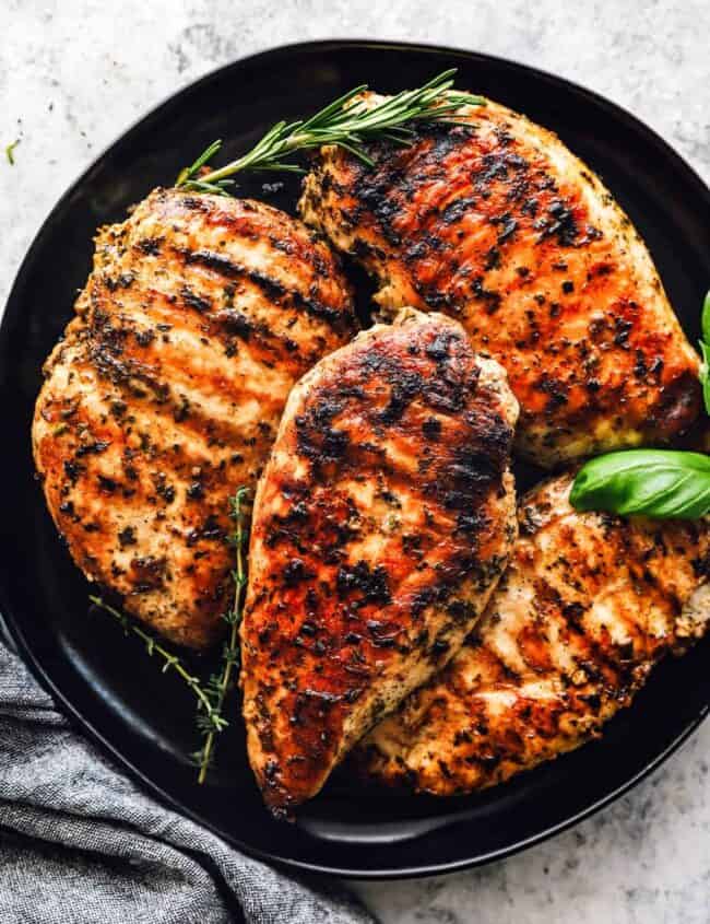 a plate of garlic herb grilled chicken breast