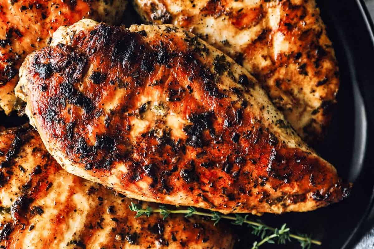 close up on grilled marinated chicken breasts