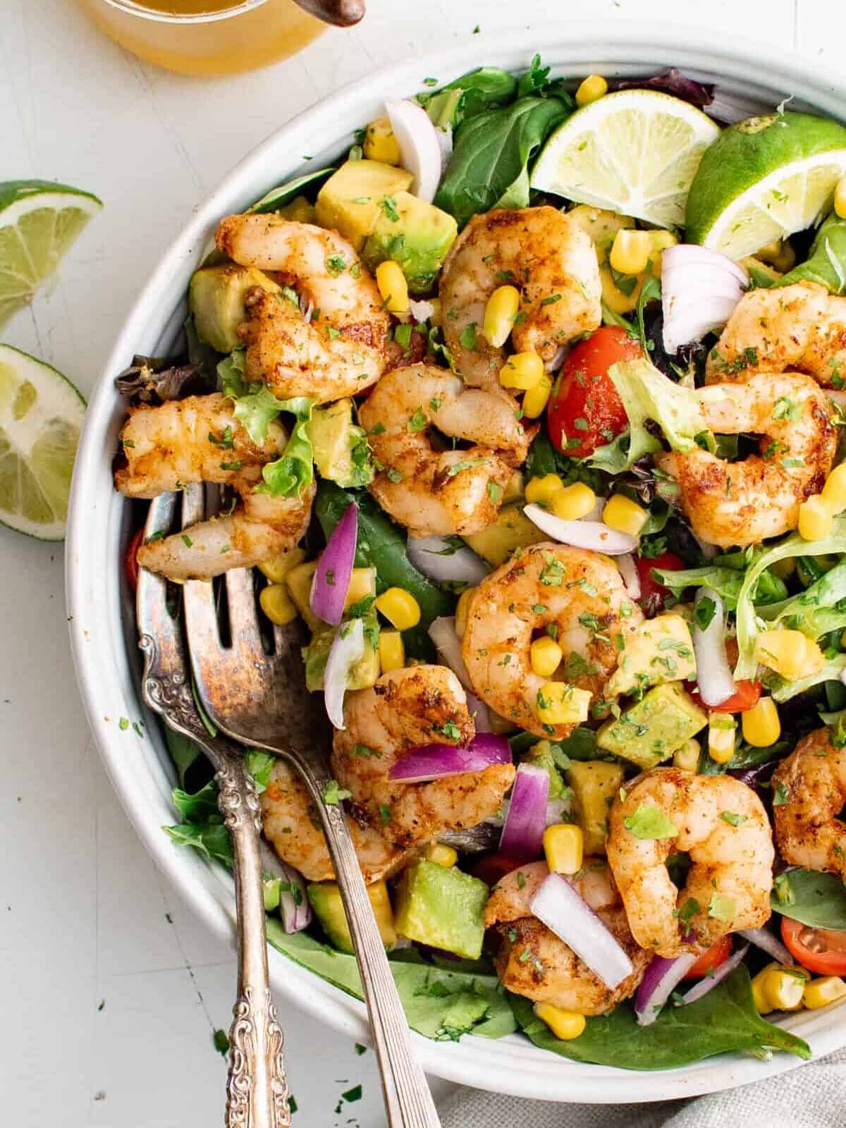 overhead view of a large bowl of grilled shrimp salad