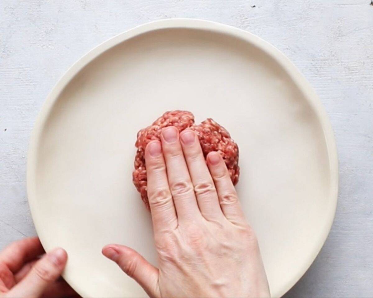 Flattening the meat out into a burger shape. - 8