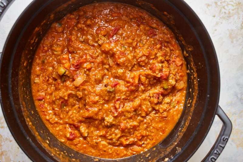 overhead view of sausage lentil soup in a dutch oven.