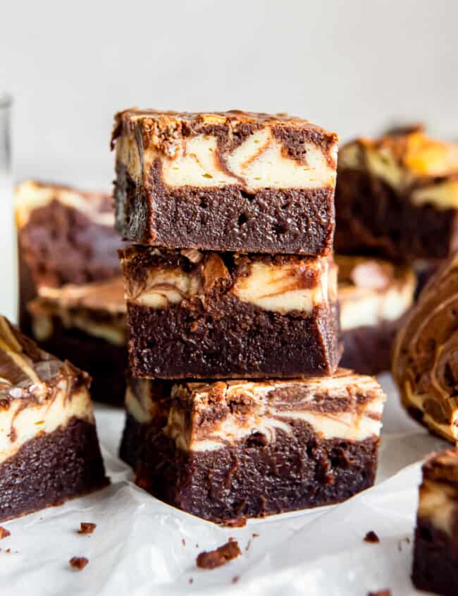 side view of 3 stacked cream cheese brownies.