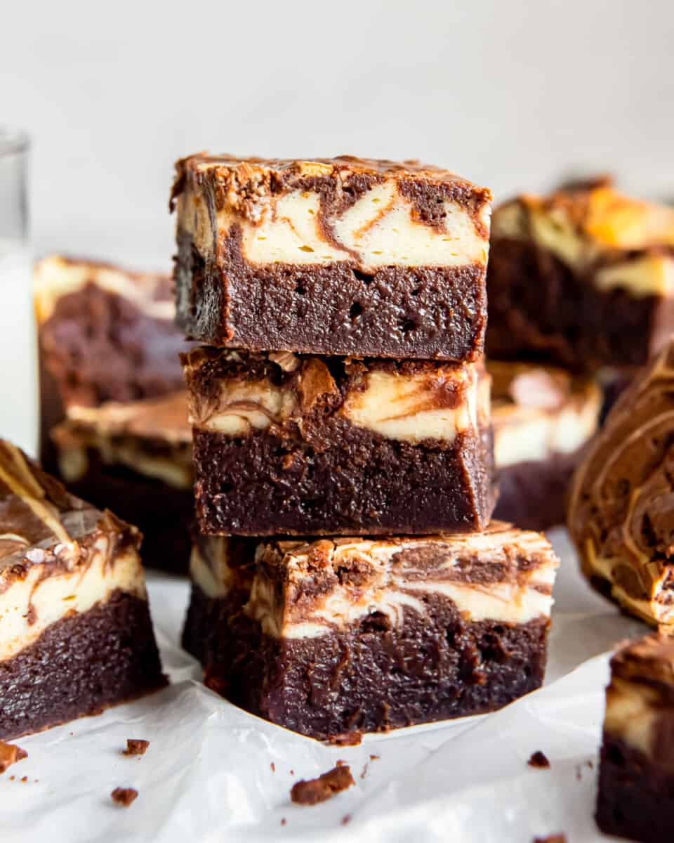 side view of 3 stacked cream cheese brownies.