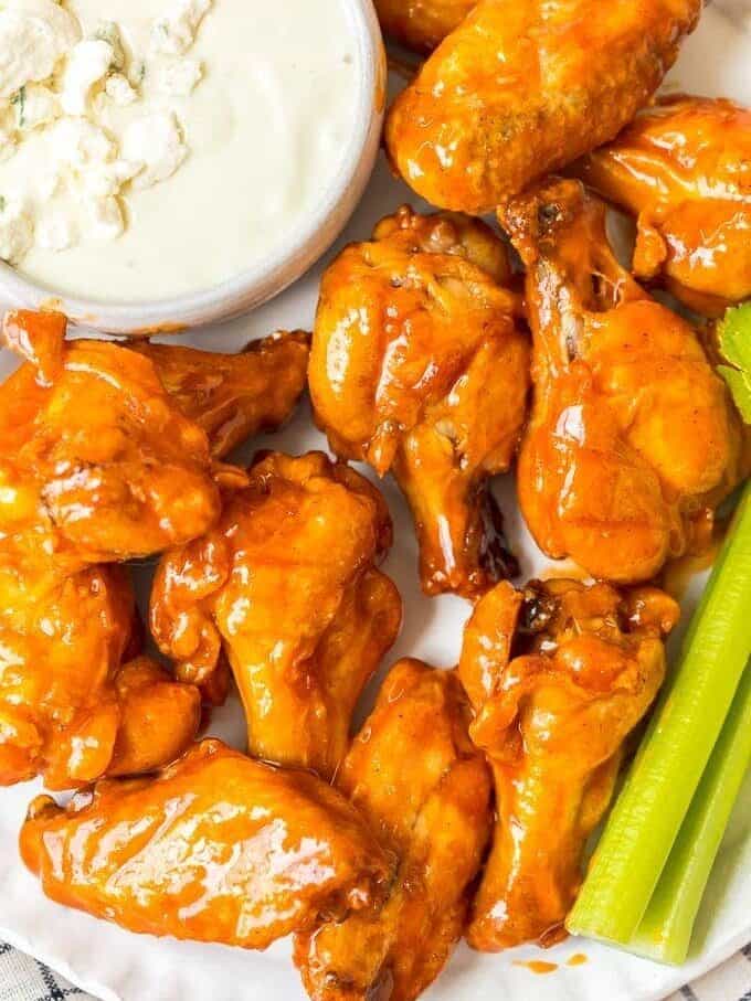 Baked Buffalo Wings on a plate with ranch and celery