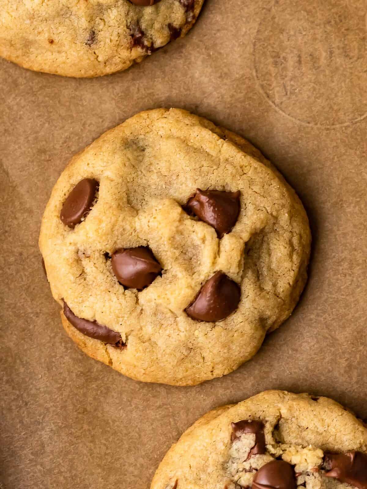 close up view of gluten free chocolate chip cookies on a baking tray