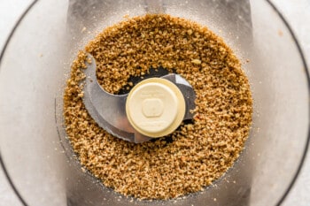 a food processor filled with granola.