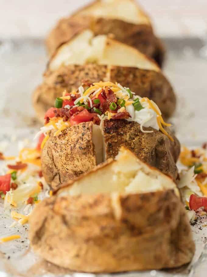 How to Cook Baked Potato is a skill that anyone can master in the kitchen. Everyone should know HOW TO COOK a PERFECT BAKED POTATO! These baked potatoes turn out tender, flavorful, and perfect every single time. We will show you how to bake a potato and all of our favorite toppings. A simple Baked Potato is the ultimate easy side dish recipe! the perfect baked potatoes