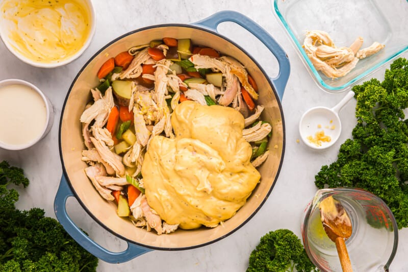 a large pot with chicken and vegetables in it.
