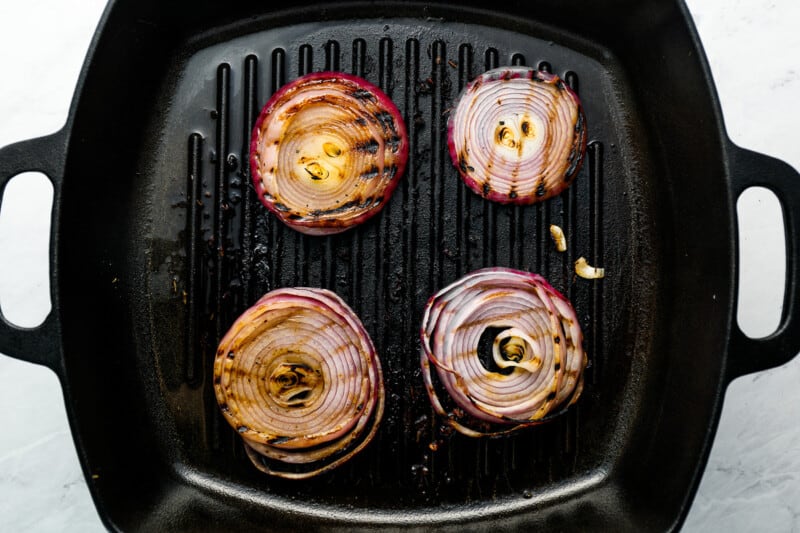 grilled red onions in a grill pan.