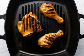 grilled korean bbq chicken on a grill pan.