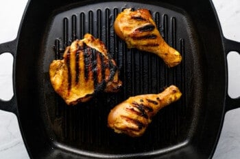 grilled korean bbq chicken on a grill pan.