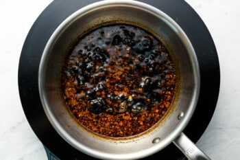 korean bbq sauce simmering in a saucepan.