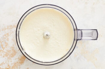 cream cheese, sour cream, and mayonnaise in a food processor.