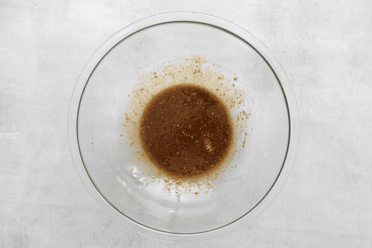 The dressing in a glass bowl. 
