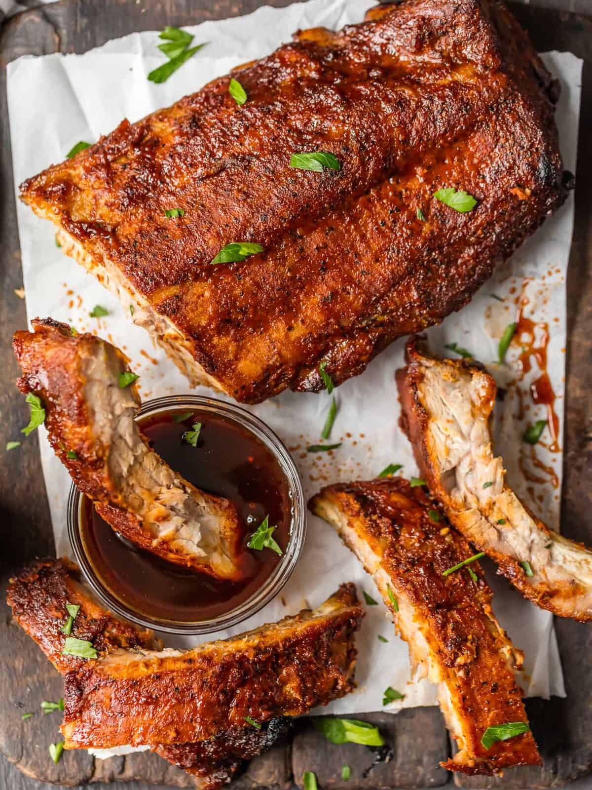 OVEN BAKED RIBS are just sooo tasty. I like cooking ribs in the oven because it's super easy and they turn out so moist. They're also great for rainy days when you don't have access to your grill. These dry rubbed ribs are one of our favorite easy dinners for summer. So kick your BBQ skills up a notch with these Easy Oven Baked Ribs, whether you're making spare ribs or baby back ribs! Either way, you're left with SO MUCH FLAVOR! Cooking ribs in the oven