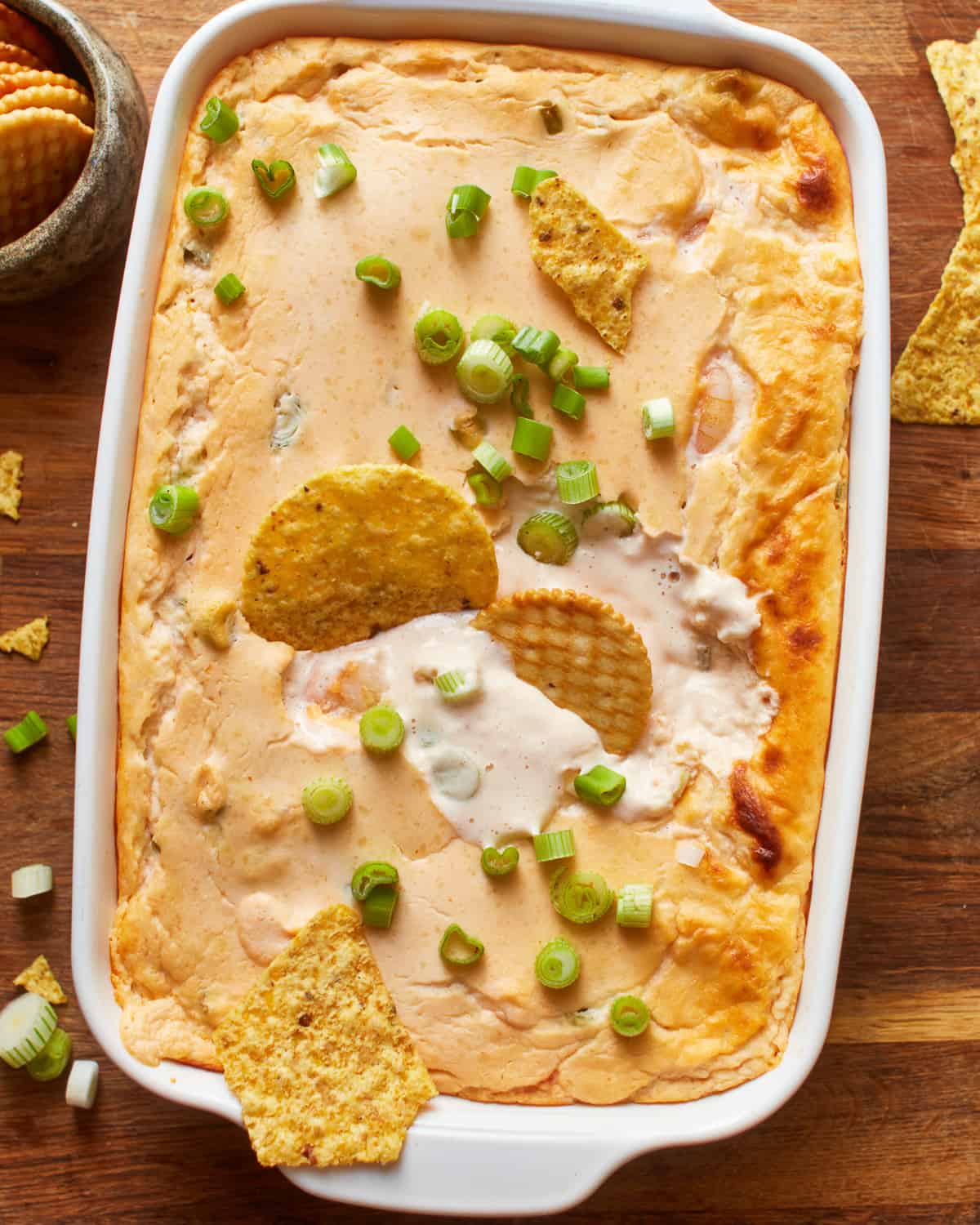 close up overhead view of shrimp dip in a white baking pan.