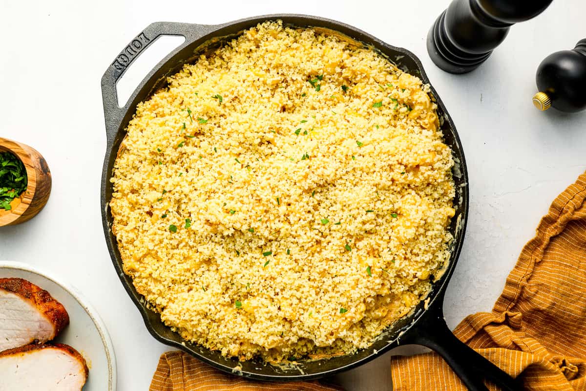 overhead view of smoked gouda mac and cheese in a cast iron pan with panko topping.