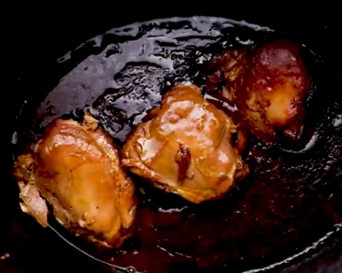 chicken being added back into the slow cooker
