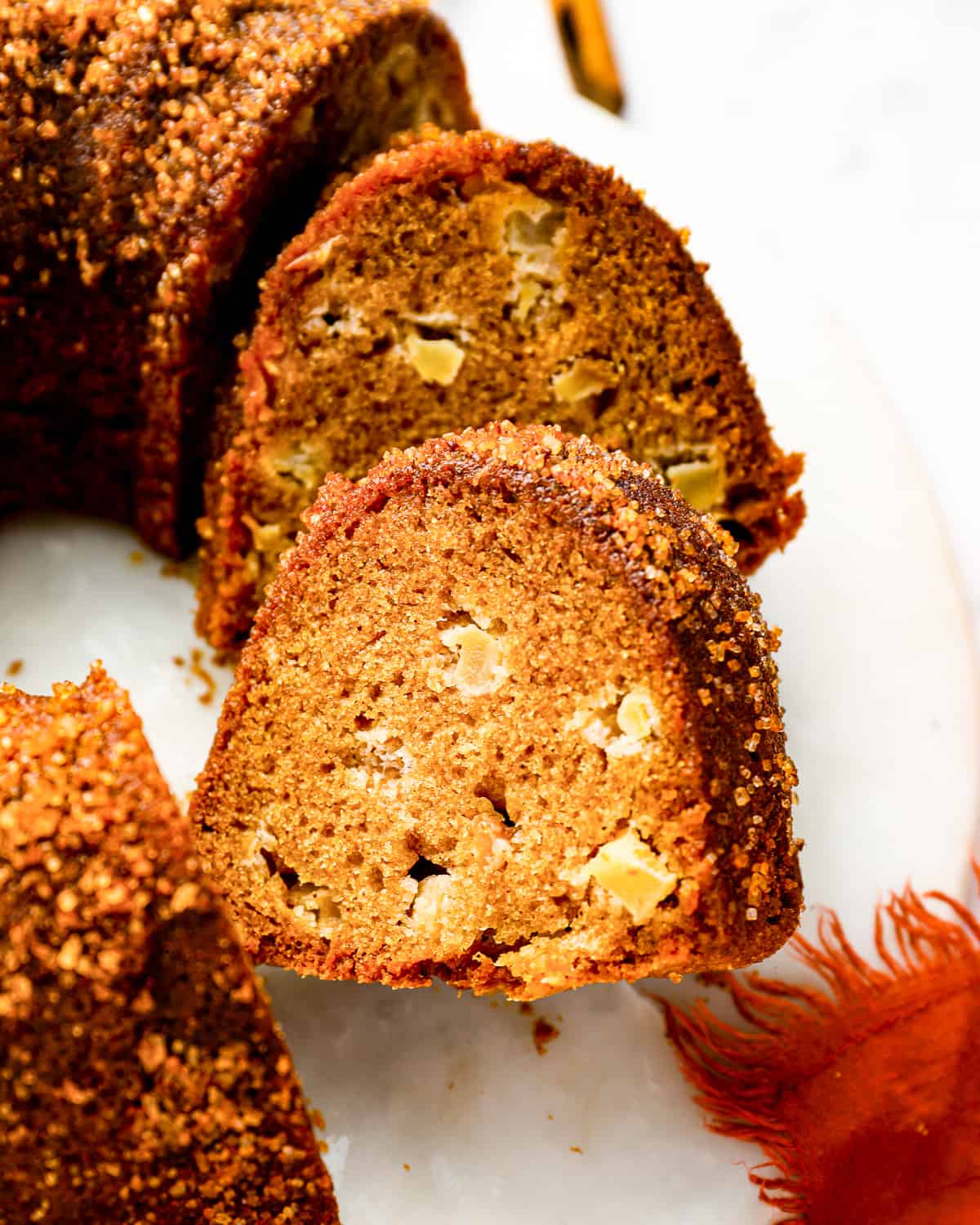 an apple bundt cake cut into slices.