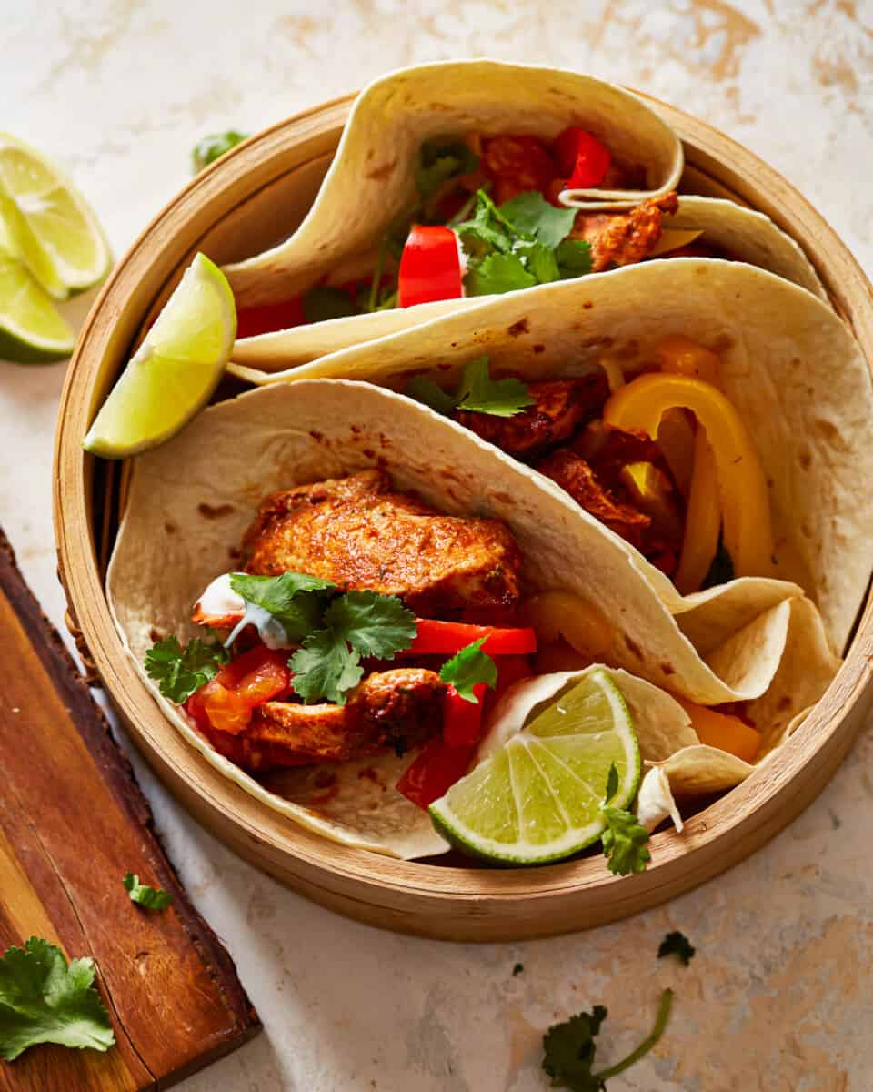 chicken fajitas in a wooden bowl.