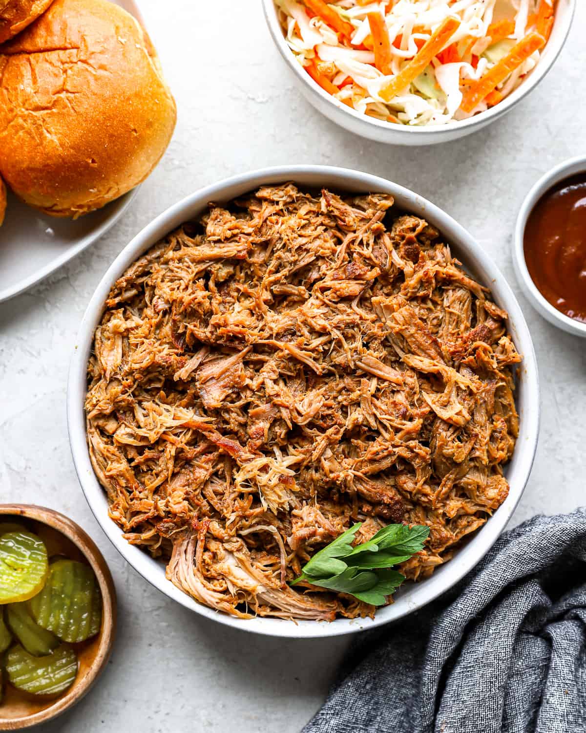 A large bowl of Crockpot pulled pork.